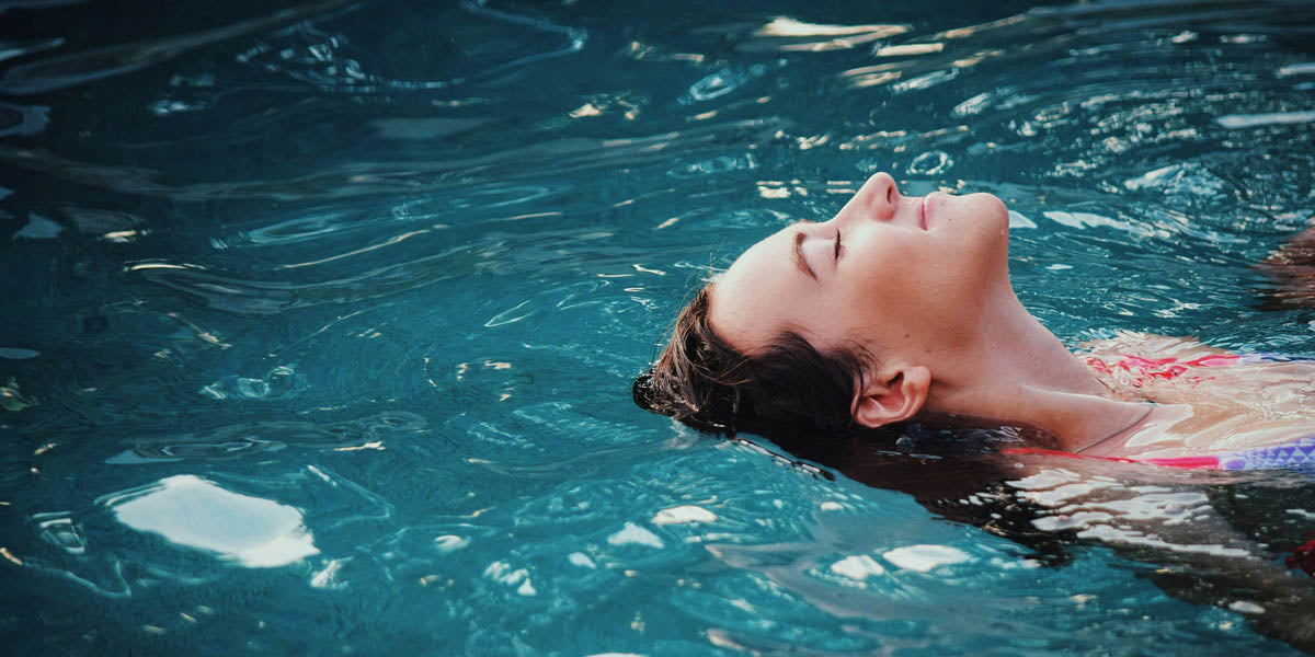 Woman floating in water