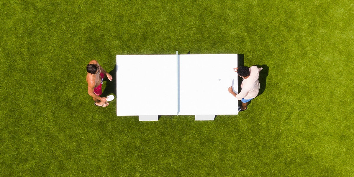 Guys playing ping pong outside