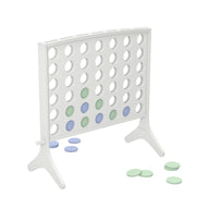 The Ledge Lounger Four In A Row is an oversized outdoor game featuring a vertical stand with circular holes. Light green and blue chips are strategically placed, with others scattered on the floor, resembling the classic four-in-a-row game setup.