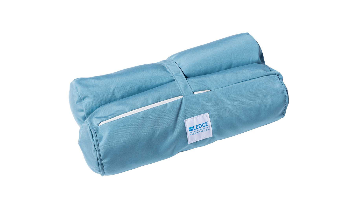 The Ledge Lounger Laze Hammock, featuring blue material with white piping and matching straps, perfect for outdoor adventures.