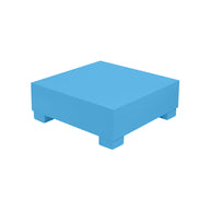 The Signature Coffee Table by Ledge Lounger, part of the Signature Collection, is a blue square platform on four short legs against a plain white background.