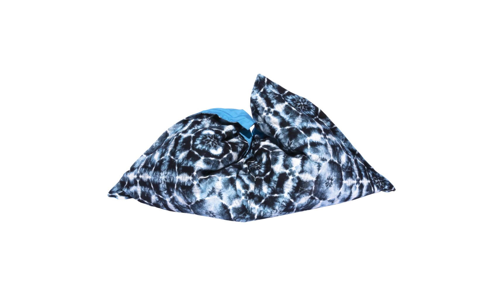 The Laze Pillow by Ledge Lounger is a large, soft bean bag featuring a black and white tie-dye pattern with a touch of blue, ideal for outdoor lounging or as a floating pool cushion, shown on a plain white background.
