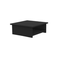 The Echo Side Table by Ledge Lounger features a square, black rectangular top and a lower open shelf, showcasing minimalistic design. Perfect as a wooden coffee table for patios, it’s displayed centrally against a white background.