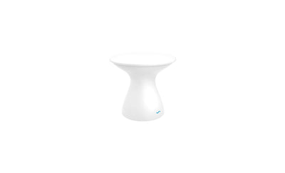 The Autograph Standard Side Table by Ledge Lounger features a minimalist white design with a smooth hourglass shape and a small blue accent near the base, ideal as an outdoor side table on a white background.