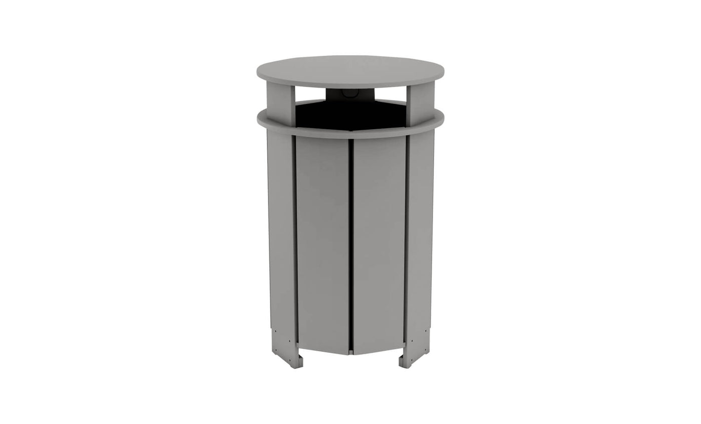 The Ledge Lounger Mainstay Trash Bin is a gray, cylindrical patio trash can with a slatted design and a slightly overhanging round lid. Made from UV stable materials, it stands on four feet to elevate it from the ground for optimal outdoor use.