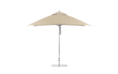 The Ledge Lounger Essential Fiberglass Umbrella, featuring a 10 square canopy made from marine-grade fabrics and a central silver pole, is securely supported by one of the reliable bases on a flat circular foundation.