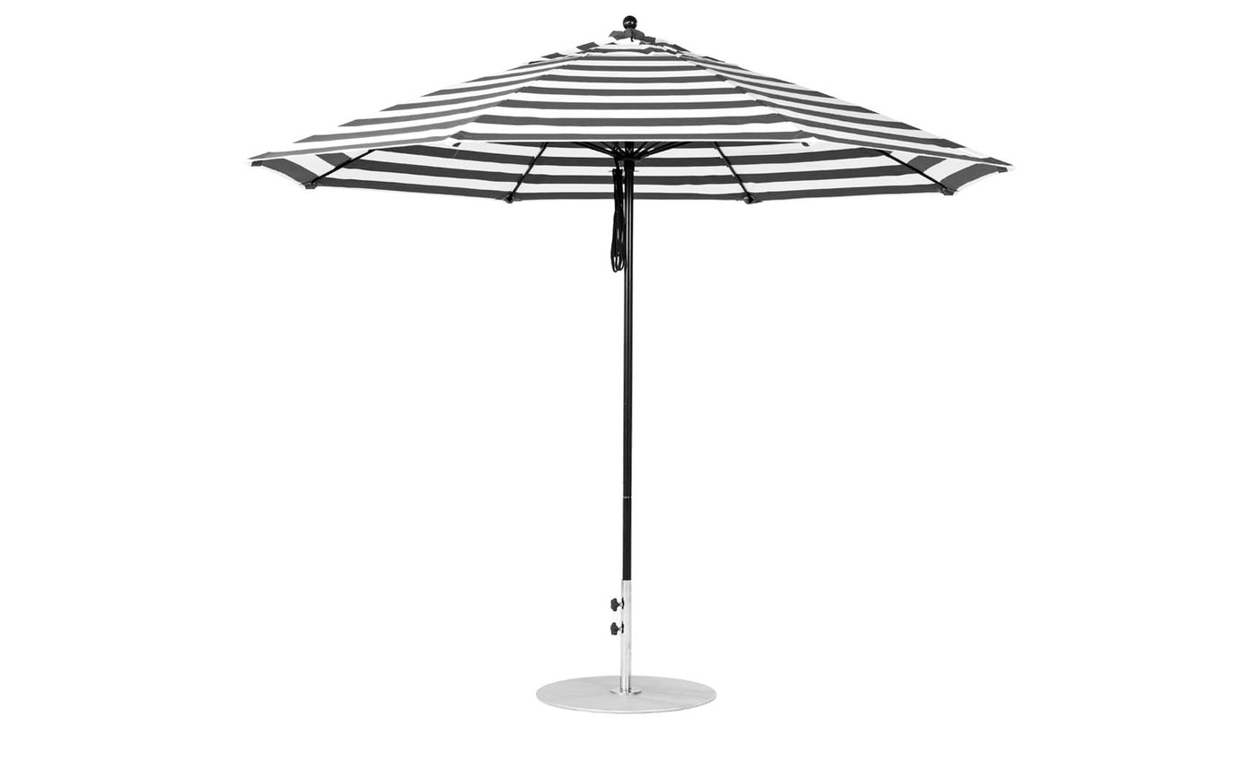 The Essential Fiberglass Umbrella - 11 Octagon Pulley by Ledge Lounger features a durable black and white striped design made from marine-grade fabrics.