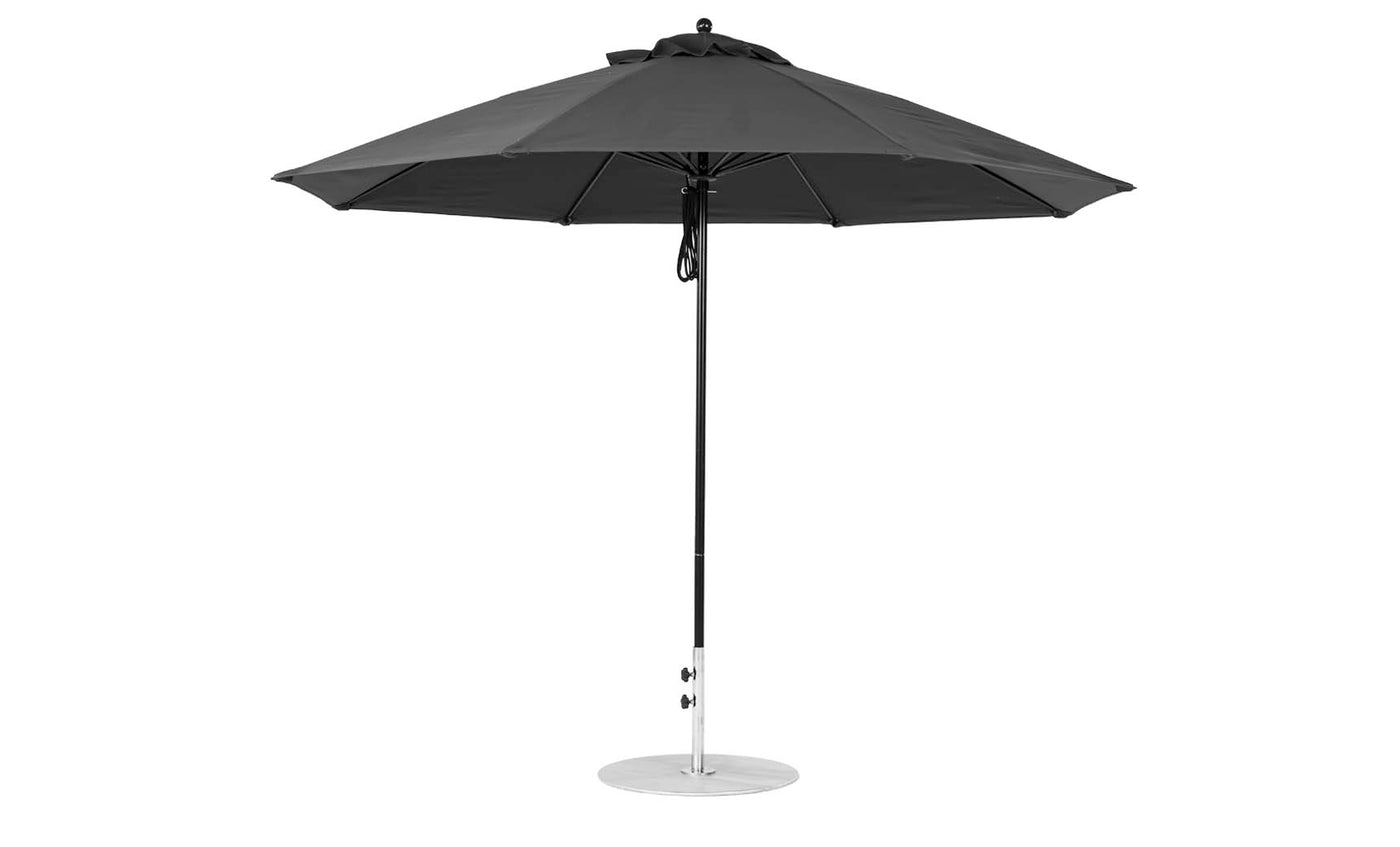 The Ledge Lounger Essential Fiberglass Umbrella features an 11 octagon canopy made from marine-grade fabrics, a metal pole, and stands on a circular base against a plain white background.