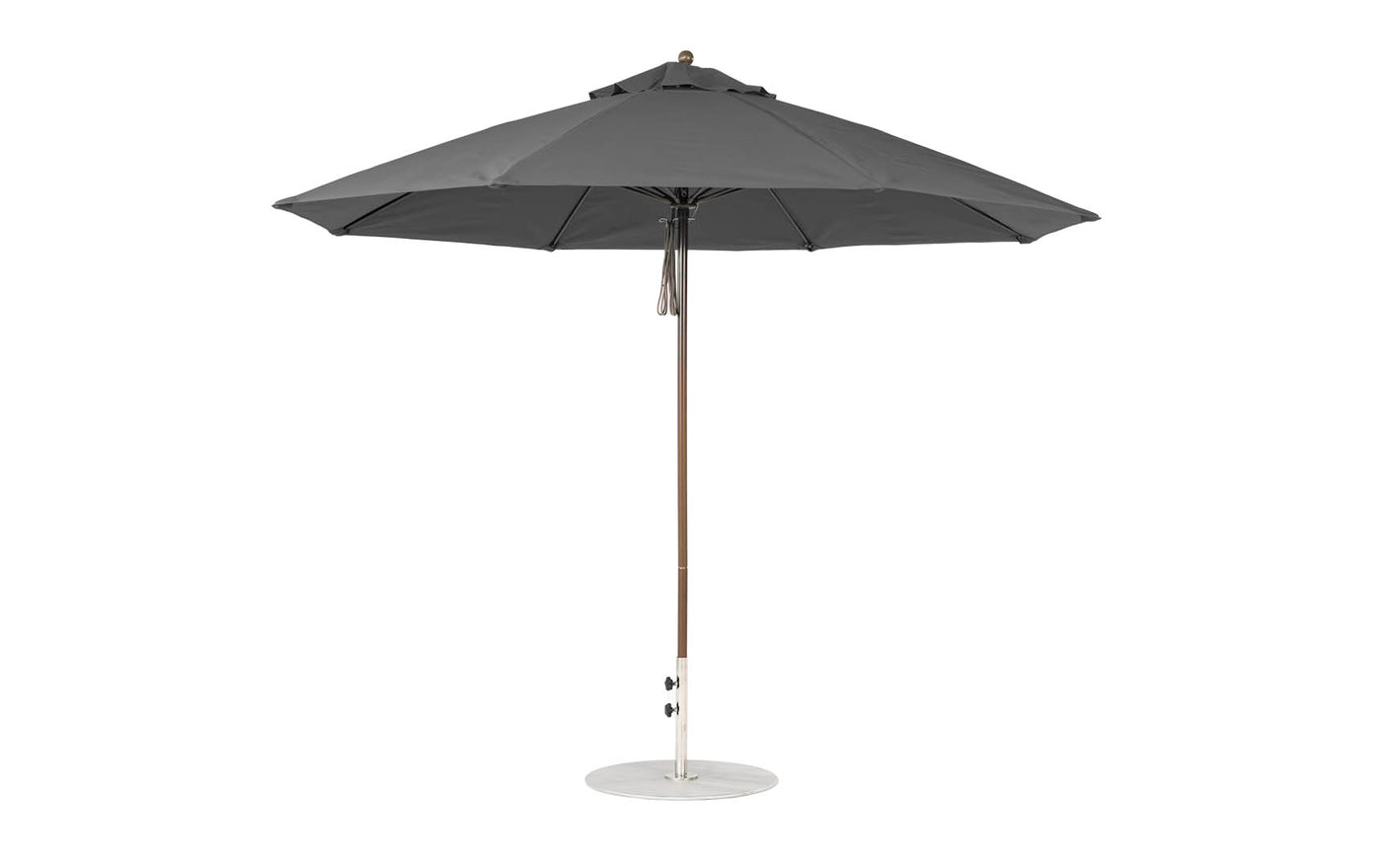 The 11 Octagon Pulley Essential Fiberglass Umbrella by Ledge Lounger stands upright with a wooden pole and metal base. Its sleek, modern design, wind resistance, and marine-grade fabrics make it ideal for any outdoor setting.