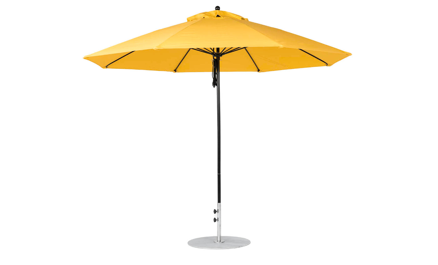 The Essential Fiberglass Umbrella - 11 Octagon Pulley by Ledge Lounger is a bright yellow, wind-resistant outdoor umbrella with a wide canopy and central metal pole, designed to stand upright on a circular base for optimal shade.