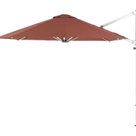 The Ledge Lounger Ultra Cantilever Umbrella boasts an 11 octagonal canopy in brown attached to a white vertical pole. Positioned to the left, it offers ample shade and features an outdoor umbrella light for enhanced patio ambiance.