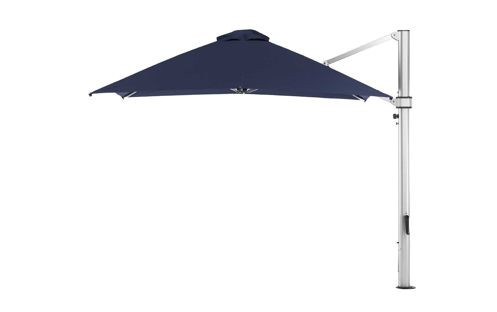 The Ledge Lounger Ultra Cantilever Umbrella - 10 Square in navy blue features a metallic stand and adjustable arm, paired with a rechargeable light. Its wide open canopy provides ample shade while the stand is set aside.