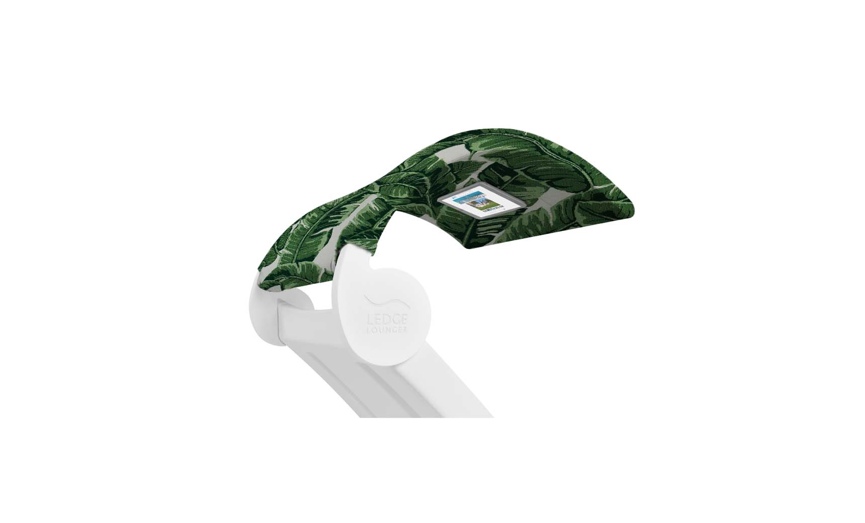The Ledge Lounger Signature Chaise Shade is a white pool lounge chair with a green leaf-patterned canopy and media viewing window for devices, ensuring ergonomic comfort while you relax.