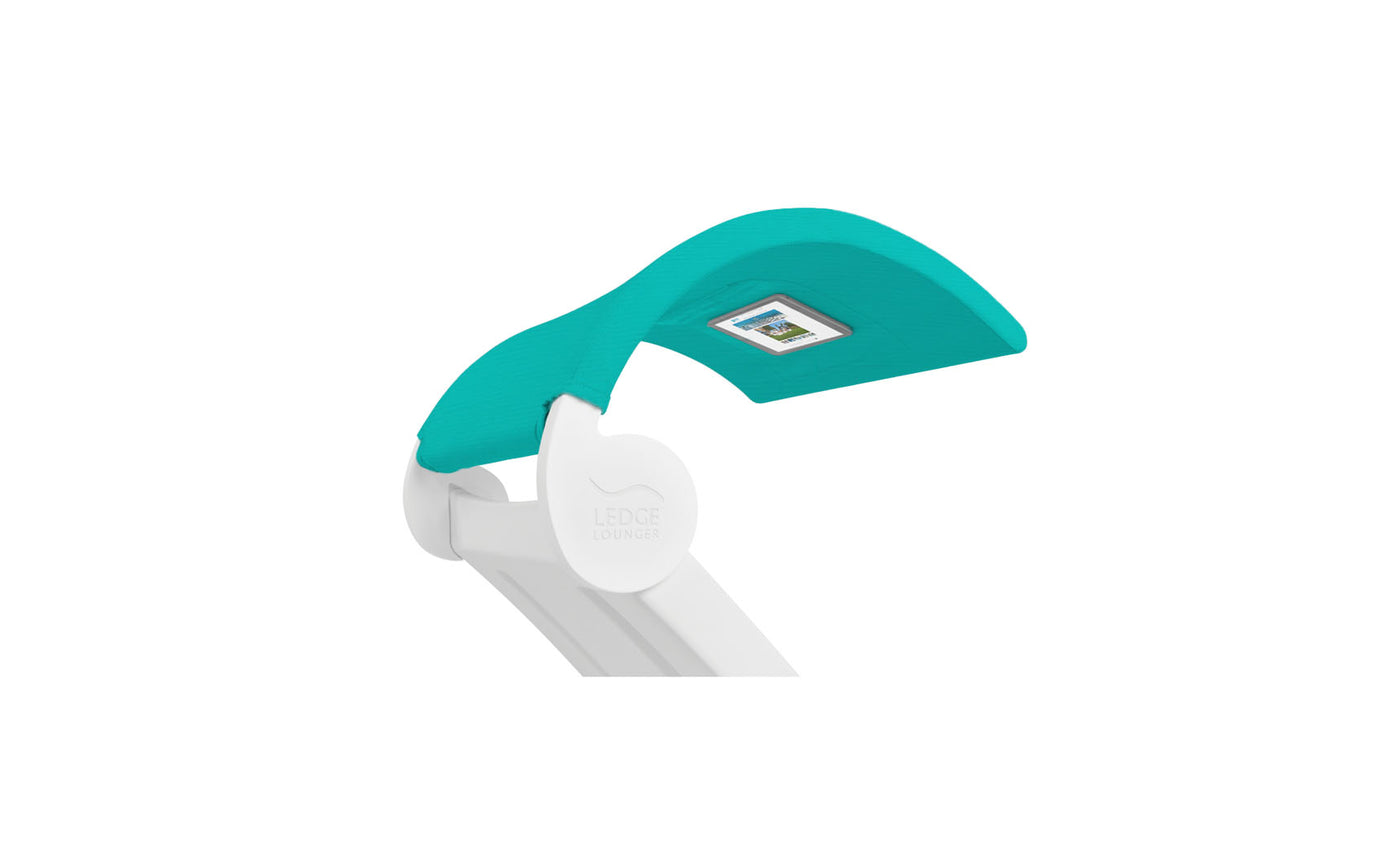 The Ledge Lounger Signature Chaise Shade is a white desk lamp with a signature turquoise shade and a small digital display inside. It showcases a modern and minimalist design.