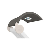 The Signature Chaise Shade by Ledge Lounger is a modern desk lamp featuring a dark green shade and a top digital display, ideal for media viewing. It boasts a sleek design with a white base and side logo LEDGE.