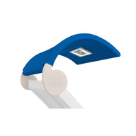 A blue curved canopy, labeled LEDGE LOUNGER at the base, attaches to a white Signature Chaise Shade by Ledge Lounger. It includes a rectangular solar panel on top and is perfect for outdoor sun protection.