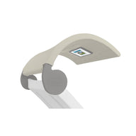 A close-up of the Signature Chaise Shade by Ledge Lounger, a sleek desk lamp with a beige fabric curved shade. It features an underside digital display and a sturdy matte gray base, offering a minimalistic design perfect for any contemporary workspace.