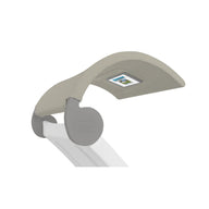 A modern, adjustable LED desk lamp with a curved gray and white design featuring a digital display. Its sleek structure resembles the Ledge Lounger’s Signature Chaise Shade, enhancing a contemporary and minimalist aesthetic.