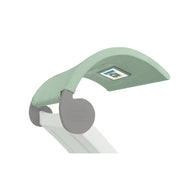 The Signature Chaise Shade by Ledge Lounger is a modern ergonomic headrest with a light green fabric cover, small media viewing window, and sleek white frame with gray accents, combining style and functionality in one innovative piece.