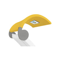 The Signature Chaise Shade by Ledge Lounger is a yellow and gray desk lamp featuring a curved design, flat lamp head with a lighting panel, and branded circular base. Its white arm adds elegance to any workspace, ideal for distinctive style and media viewing.