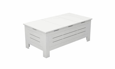 The Mainstay Storage Coffee Table by Ledge Lounger is a white, rectangular wooden bench ideal for outdoor living spaces. It features slatted sides and a solid hinged top that opens for storage. With four sturdy legs, its minimalist style complements any setting effortlessly.