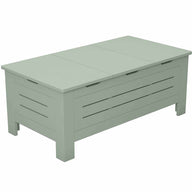 The Mainstay Storage Coffee Table by Ledge Lounger is a light green, wooden table with slatted sides and a hinged top. Ideal for outdoor spaces, it features clean lines, four sturdy legs, and ample storage underneath.