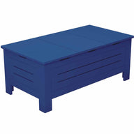The Mainstay Storage Coffee Table by Ledge Lounger is a blue wooden table featuring a smooth lid, slatted side panels, and four short legs, providing ample storage space for your outdoor living area.