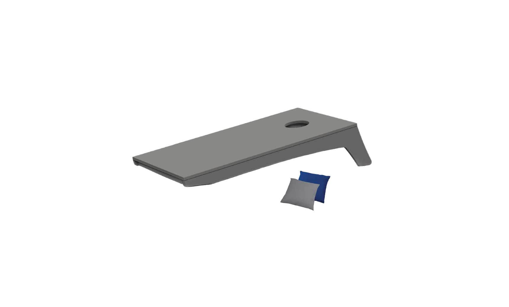 The Ledge Lounger Cornhole, a portable set featuring a gray board with a round hole, comes with two small beanbags—one blue and one gray—ready for play.