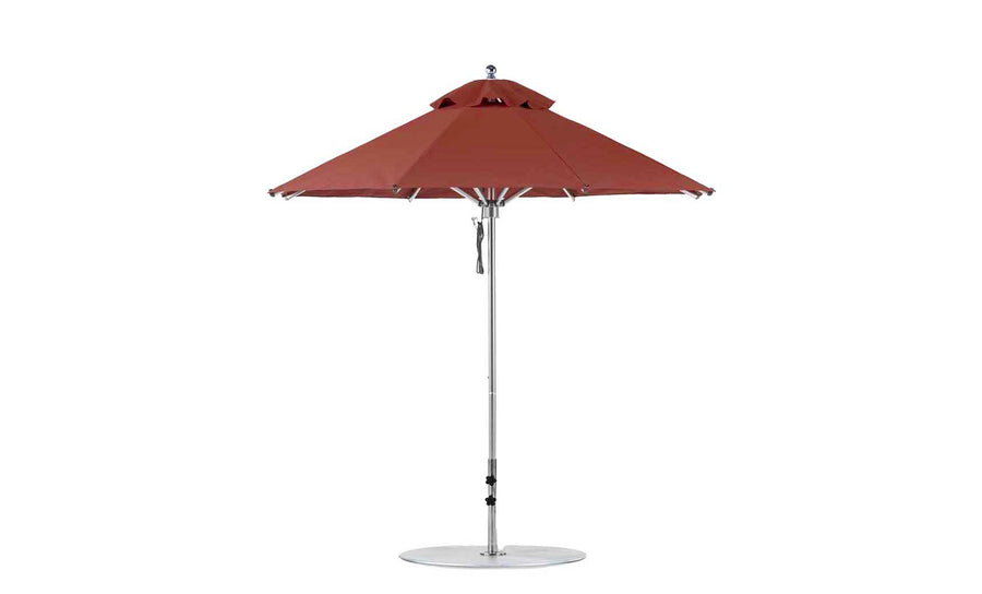 The Ledge Lounger Premier Aluminum Umbrella - 7.5 Octagon Pulley features a dual canopy of marine-grade fabrics, perfect for outdoor in-pool and on-deck use. Its sleek silver pole stands on a round base, with a top vent for wind resistance.
