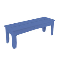 A simple Mainstay Dining Bench by Ledge Lounger, blue and rectangular with clean lines and slightly tapered legs, viewed at an angle. The bench appears to be made of wood or a similar solid material.