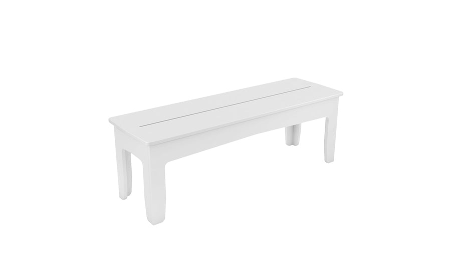 The Mainstay Dining Bench by Ledge Lounger is a sleek white rectangular bench with four legs, featuring a simple, smooth surface and clean lines. Ideal for modern or contemporary settings, it perfectly suits outdoor dining scenarios.