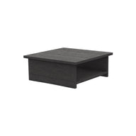The Echo Side Table by Ledge Lounger is a dark gray, square wooden table featuring a solid top and an open shelf underneath for storage. It boasts a simple, minimalist design and is set against a plain white background.