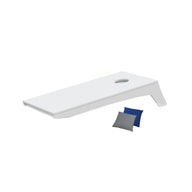 The Ledge Lounger Cornhole is a minimalist, portable set featuring a sleek board with a single hole against a white background. It comes with two small bean bags—one blue and one gray—ideal for an impromptu toss game.