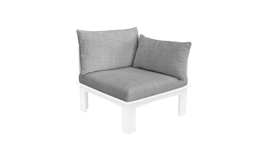 The Mainstay Sectional Relaxed Left Armchair by Ledge Lounger features a white frame and gray cushions, offering a minimalist design. With thick, textured cushions, this piece provides a cozy modern look suitable for both outdoor and indoor configurable seating.