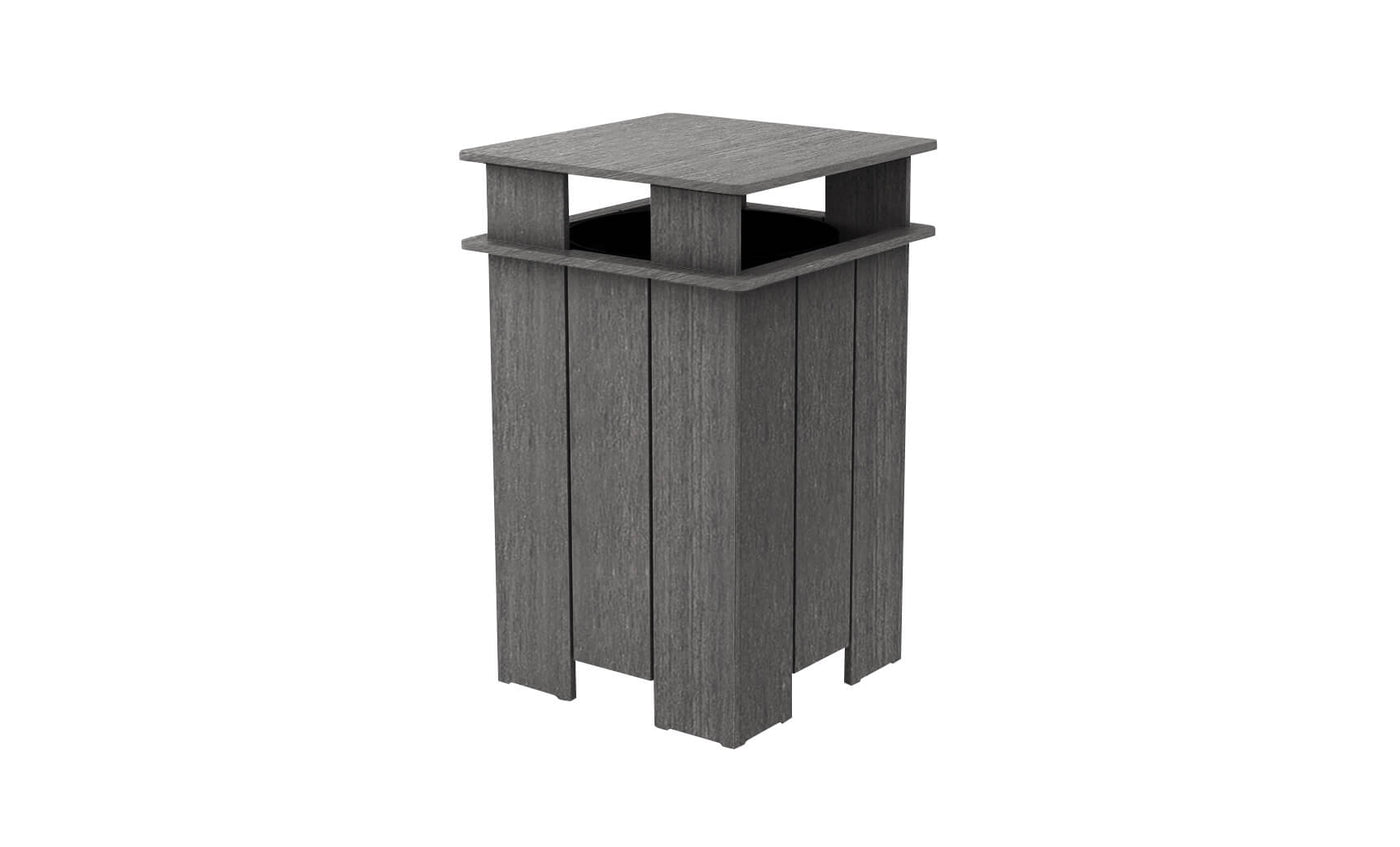 The Mainstay Trash Bin by Ledge Lounger is a square, gray recycling bin with modern vertical slats and an open top for easy access. Made from UV stable materials, its ideal for indoor use or as a patio trash can.