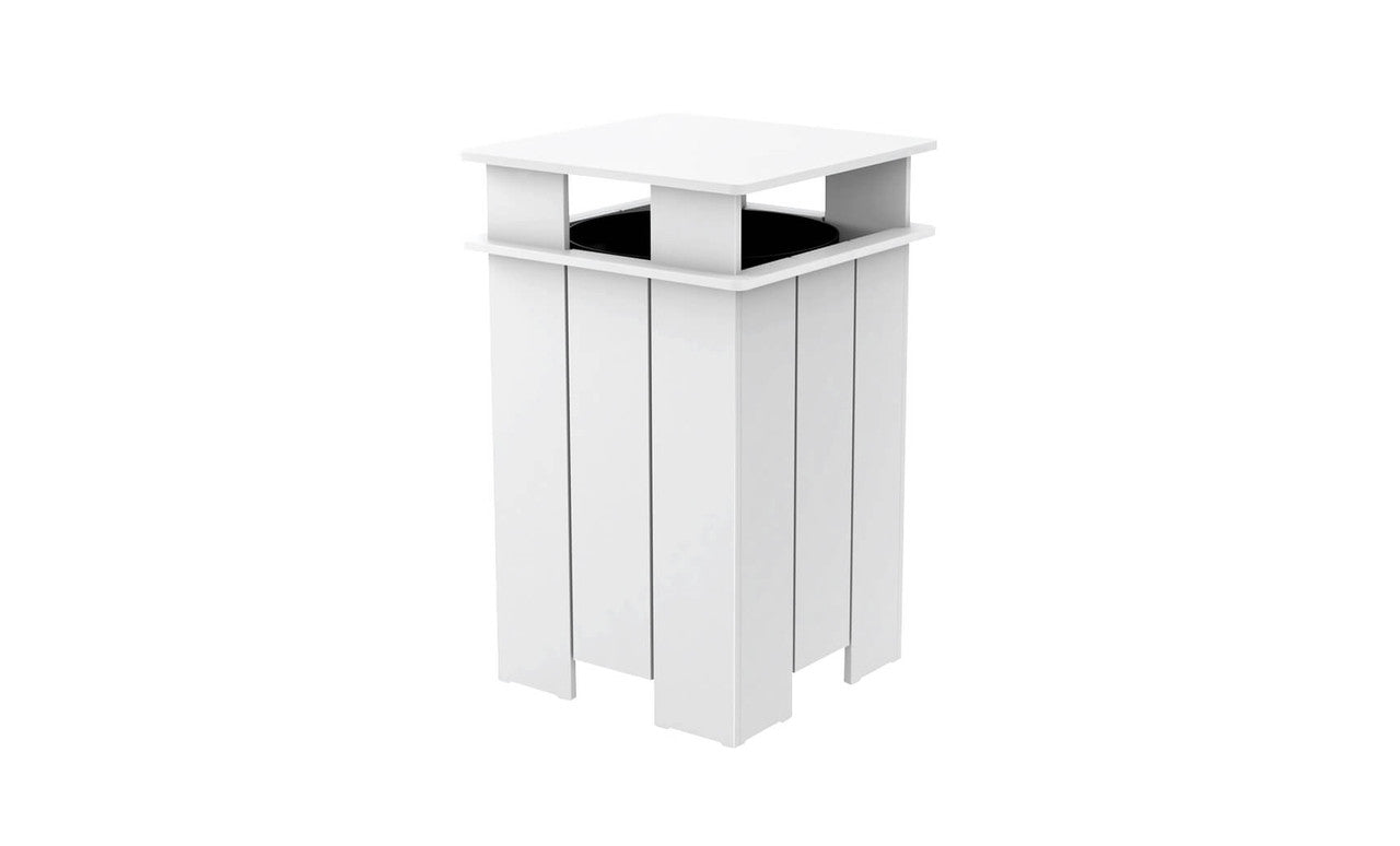 The Mainstay Trash Bin by Ledge Lounger is a modern, sleek white pedestal stand with a square top and open design, made from UV stable materials. Featuring vertical slats and a partially visible black circular object inside, its minimalist look suits contemporary indoor or patio decor.