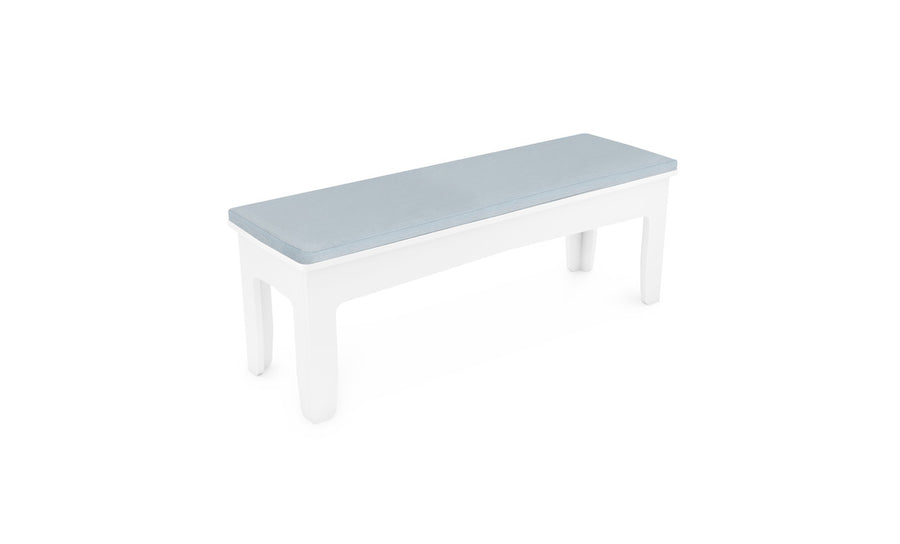 The Mainstay Dining Bench Cushion by Ledge Lounger features a sleek white frame and light blue cushioned seat, combining comfort and style with its clean lines and armless design, set against a plain white background.
