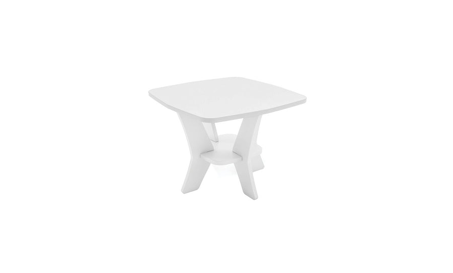 The Mainstay Square Side Table by Ledge Lounger is a small, modern white square table with rounded edges, ideal for outdoor patios. It features a unique crisscross base and a practical lower shelf for all-weather storage against a plain white background.
