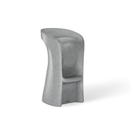 The Signature Barstool Bar Height by Ledge Lounger is a gray, modern high chair ideal for outdoor entertaining. It features a smooth design with an integrated backrest and footrest, crafted from weatherproof material with an asymmetric shape on a sturdy base, perfect for pool bar settings.