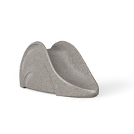 The Ledge Loungers Signature Slide is a modern gray chair with a minimalist design featuring smooth curves, a low profile, and an inclined backrest; its wide seat offers a sleek, contemporary look ideal for lounging by the tanning ledge.