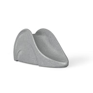 A minimalist, curved gray Signature Slide by Ledge Lounger resembling an abstract sculpture on a plain white background.