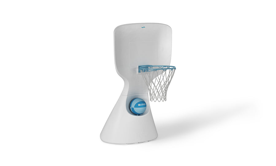 The Hoopstr by Ledge Lounger is a modern, white poolside basketball stand perfect for family fun. It features a compact, minimalist design with a smooth backboard, blue-railed hoop and net, and an easily repositionable base with a blue circular detail.