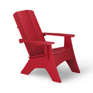 The Mainstay Ultimate Adirondack by Ledge Lounger features a wide slatted back and seat, viewed from a three-quarter angle. With broad armrests and a sturdy design, this red outdoor lounge chair stands elegantly against a plain white background.