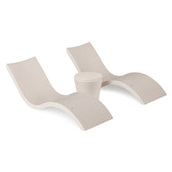 The Ledge Lounger Signature Chaise and Affinity Side Table In-Pool Set features two modern white curved chaises and a matching table on a plain white background—ideal for stylish poolside relaxation.