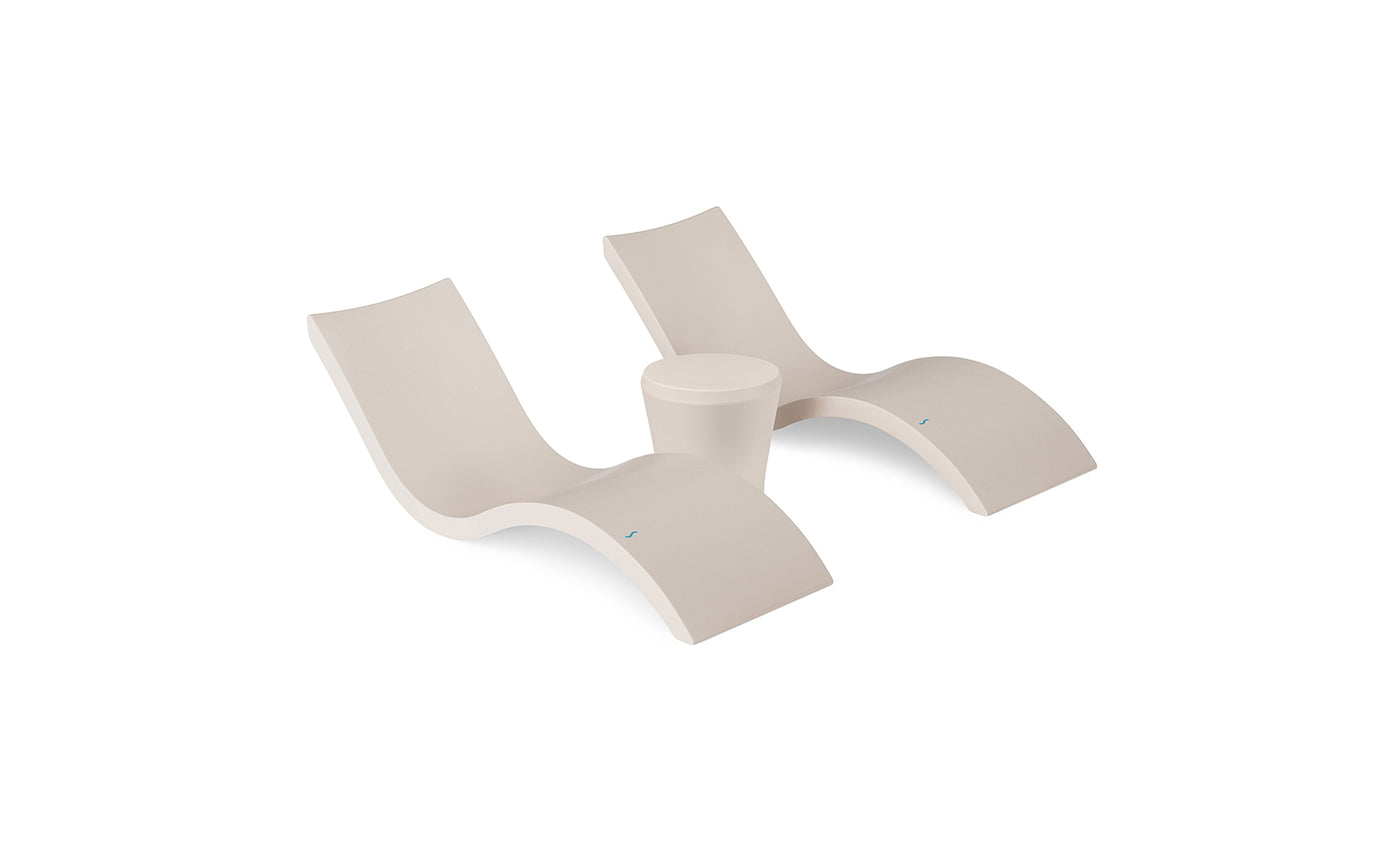 The Ledge Lounger Signature Chaise and Affinity Side Table In-Pool Set features two modern white curved chaises and a matching table on a plain white background—ideal for stylish poolside relaxation.