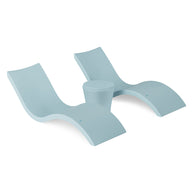 The Ledge Lounger Signature Chaise and Affinity Side Table In-Pool Set features two modern light blue chaise loungers with curved designs and a matching side table—perfect poolside essentials for relaxing in style against a white background.