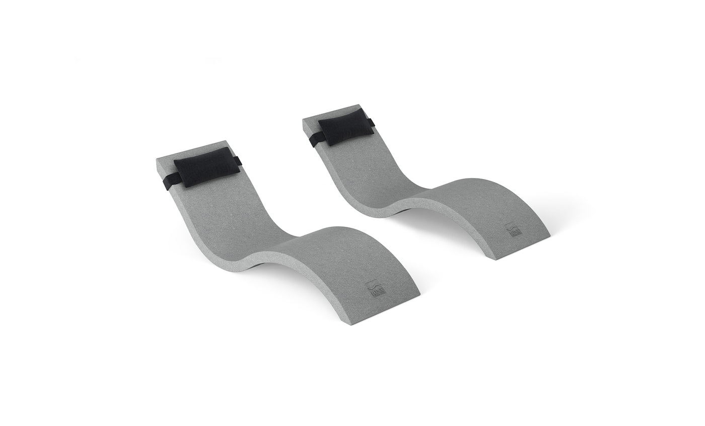 The gray, curved foam blocks with black straps from Ledge Loungers Outdoor Escape In-Pool Furniture Bundle resemble the graceful S-shape of a chaise lounge, side by side on a white backdrop and are designed to hold oars securely.