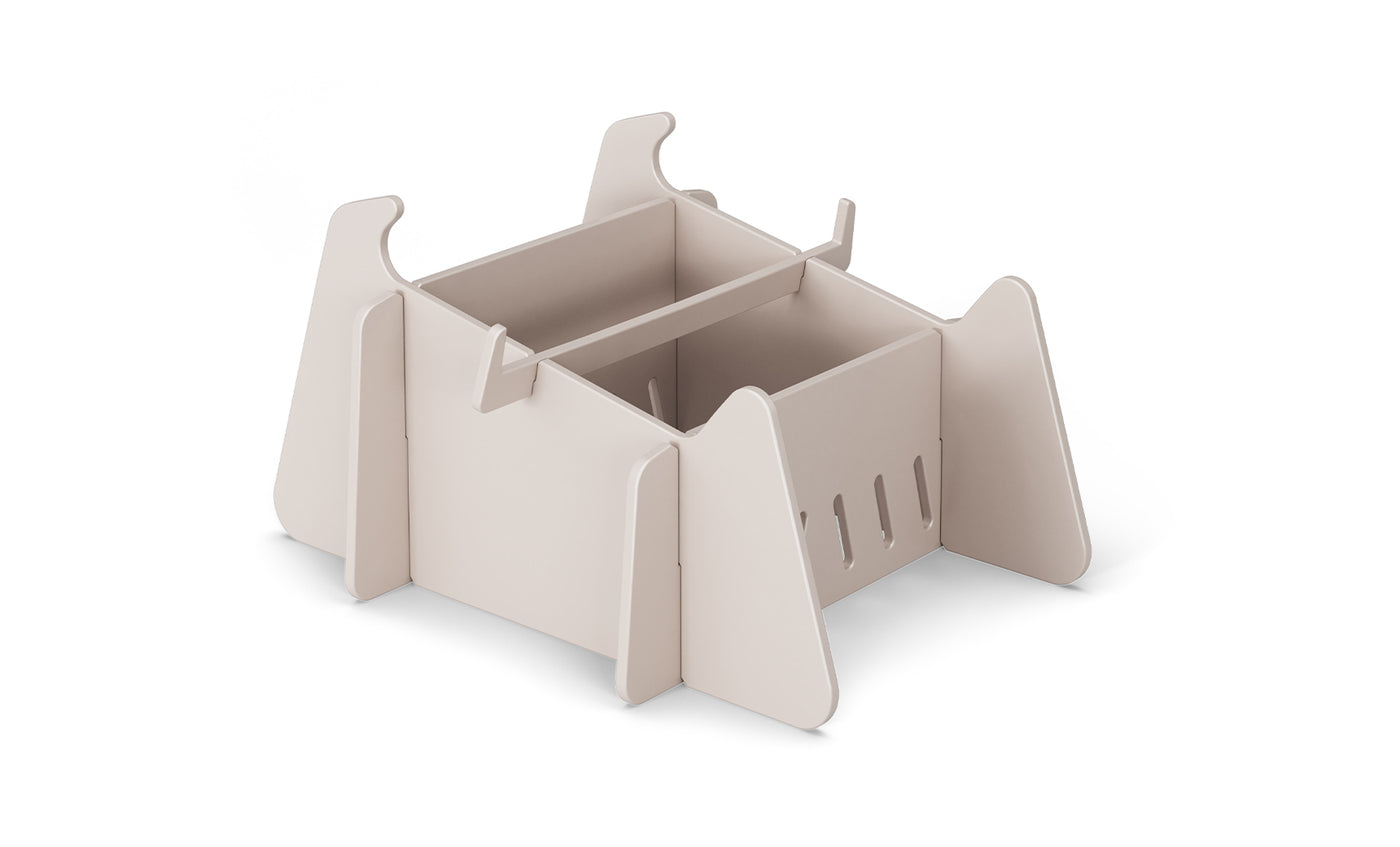 A beige, flat-pack, rectangular organizer with side panels and divided compartments, inspired by minimalist animal shapes—ideal for storing essentials after a day outdoors by your Ledge Lounger Signature Chaise Deep Riser or in-pool seats. Placed on white background.