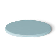 Showcased against a plain white background, this light blue silicone coaster by Ledge Lounger features a small notch on one side. Its UV-resistant design makes it an ideal match for your Signature Side Table Lid and perfect for outdoor settings.