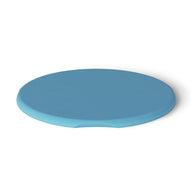 Against a white backdrop, the blue, round Signature Side Table Lid by Ledge Lounger is showcased. Made of silicone with a smooth surface and a small notch for easy removal, its perfect for outdoor use due to its UV-resistant properties.